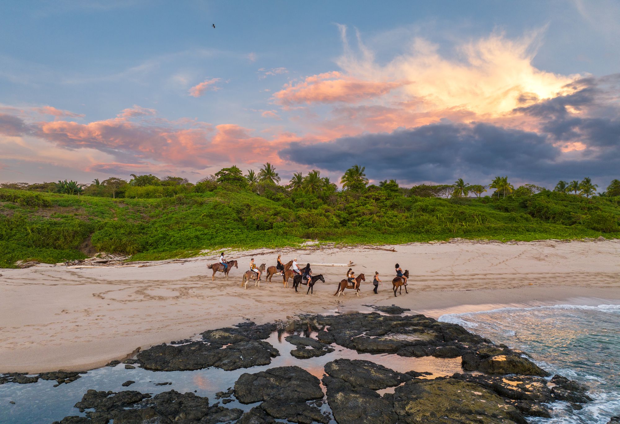 Couple on horseback trail